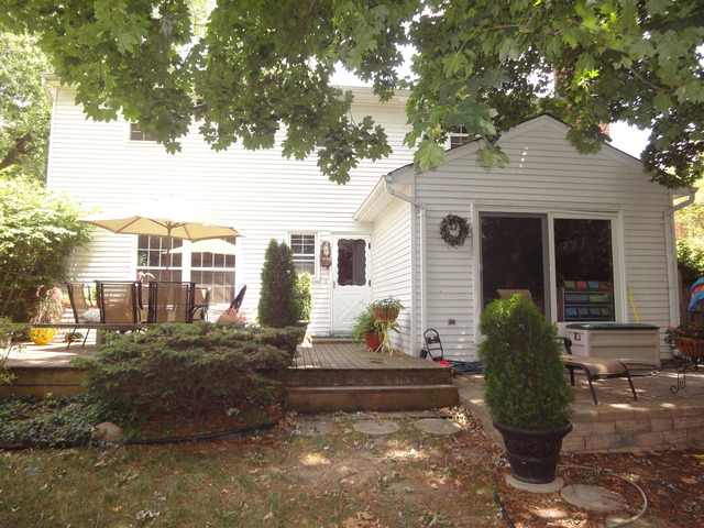 1016 Stoddard Avenue Wheaton, IL 60187 - Photo 12 of 14 a front view of a house with garden