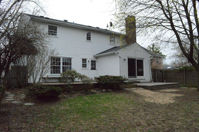1016 Stoddard Avenue Wheaton, IL 60187 - Photo 14 of 14 a backyard of a house with plants and large tree