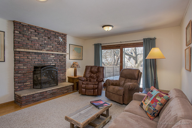 1016 Stoddard Avenue Wheaton, IL 60187 - Photo 3 of 14 a living room with furniture and a fireplace