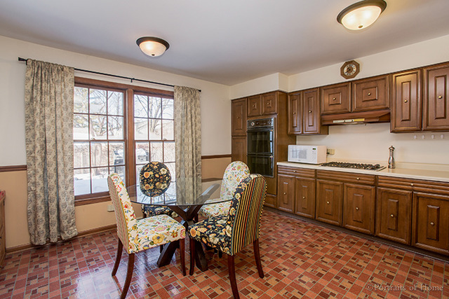1016 Stoddard Avenue Wheaton, IL 60187 - Photo 4 of 14 a view of a dining room with furniture window and outside view