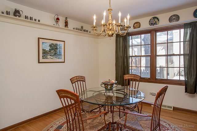 1016 Stoddard Avenue Wheaton, IL 60187 - Photo 5 of 14 a view of a dining room with furniture a chandelier and wooden floor
