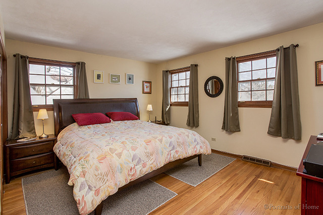 1016 Stoddard Avenue Wheaton, IL 60187 - Photo 6 of 14 a bedroom with a bed and a window