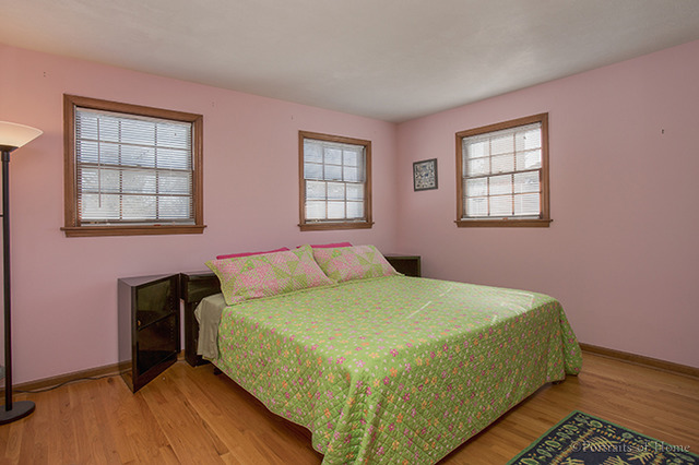 1016 Stoddard Avenue Wheaton, IL 60187 - Photo 9 of 14 a bedroom with a bed and a window