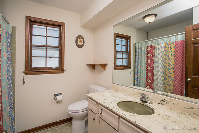 1016 Stoddard Avenue Wheaton, IL 60187 - Photo 10 of 14 a bathroom with a granite countertop sink toilet and shower