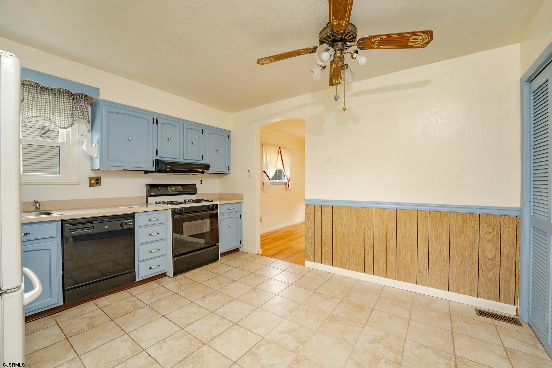 153 Jordan Road Somers Point, NJ 08244 - Photo 14 of 37 a kitchen with stainless steel appliances a stove a sink and a refrigerator