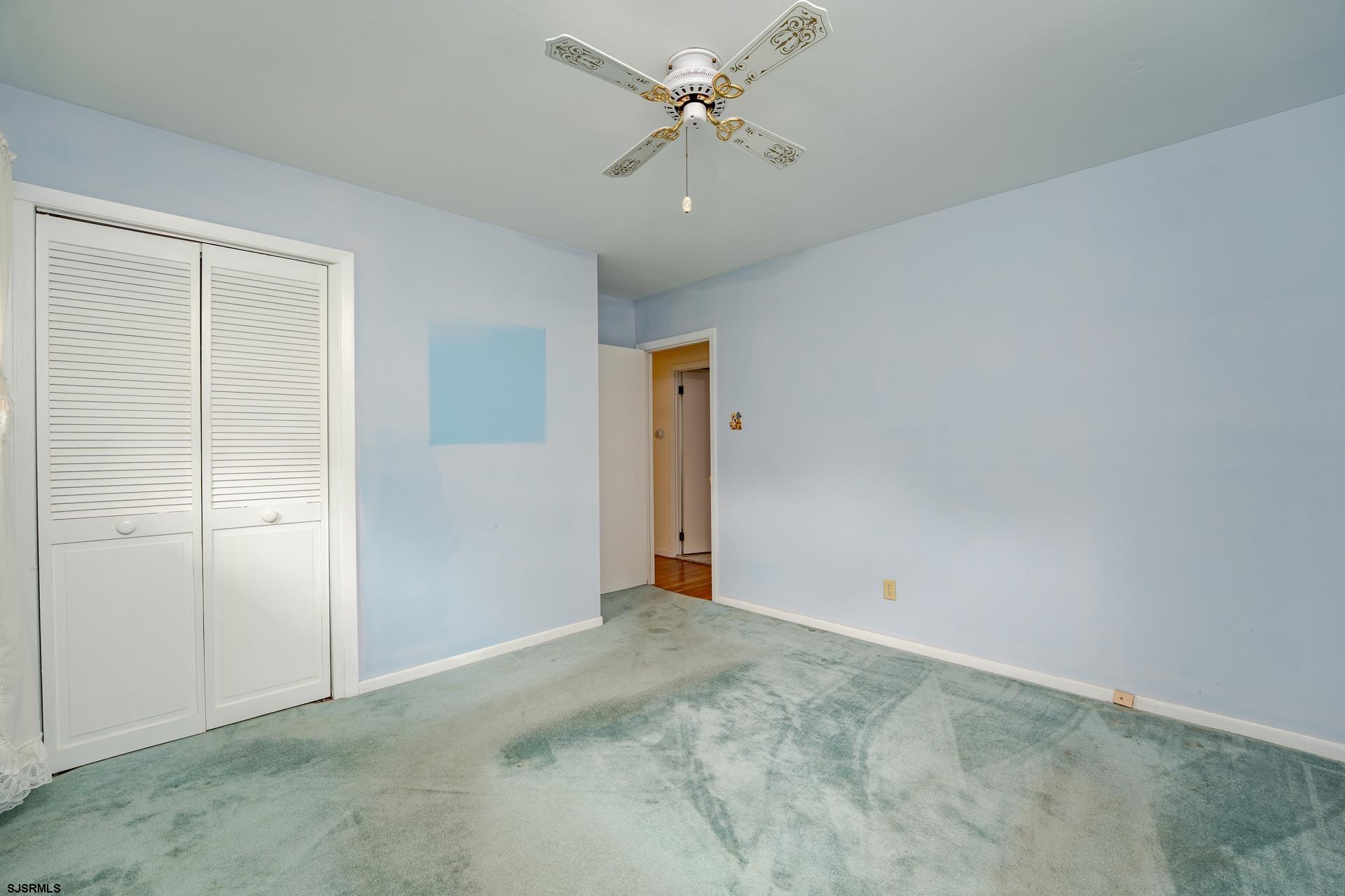 153 Jordan Road Somers Point, NJ 08244 - Photo 15 of 37 an empty room with closet and a ceiling fan