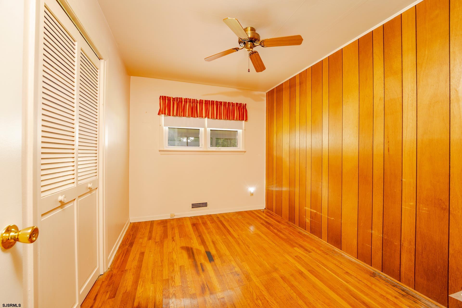 153 Jordan Road Somers Point, NJ 08244 - Photo 17 of 37 a view of a room with wooden floor and glass door