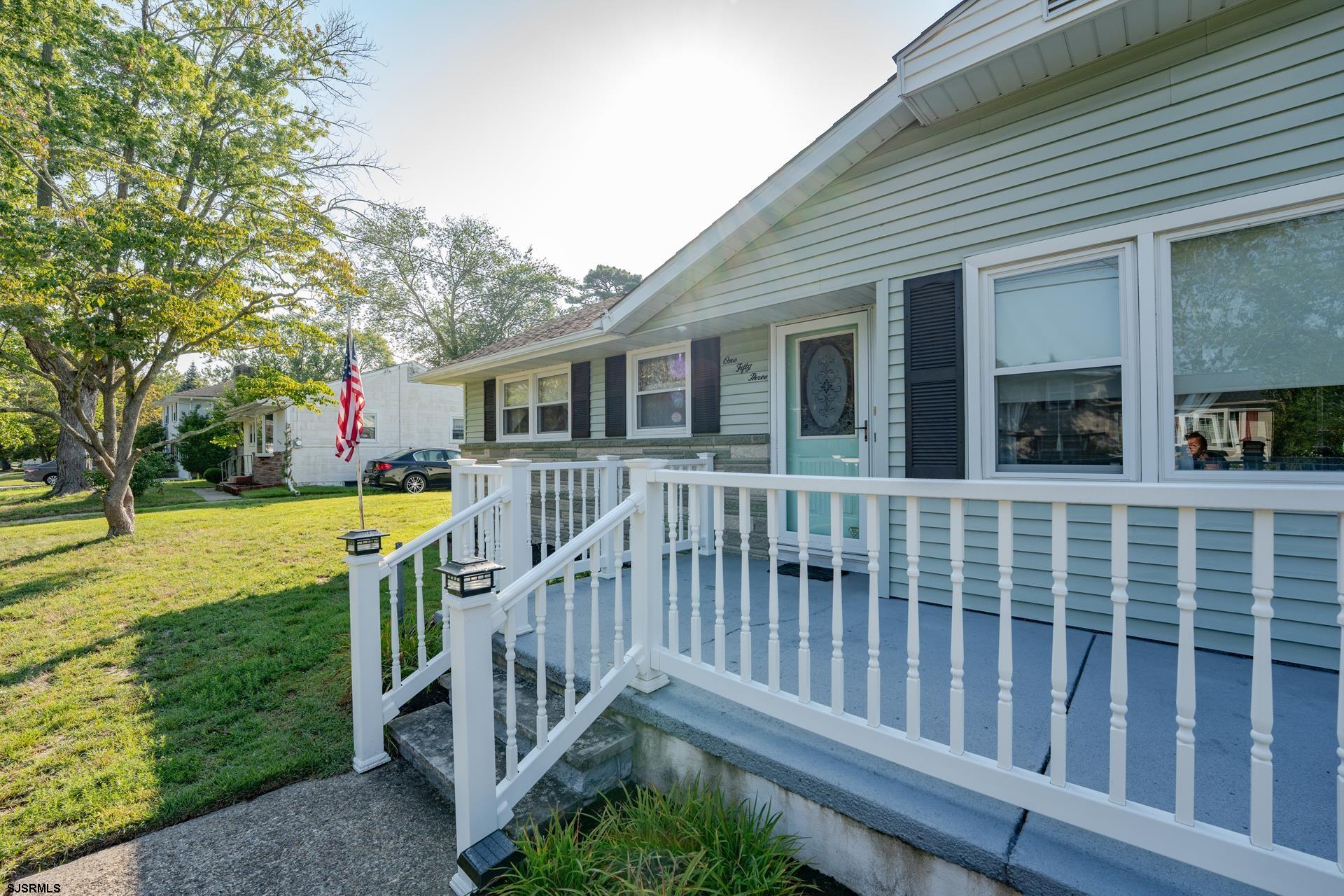 153 Jordan Road Somers Point, NJ 08244 - Photo 6 of 37 a view of a house with a wooden deck and a yard