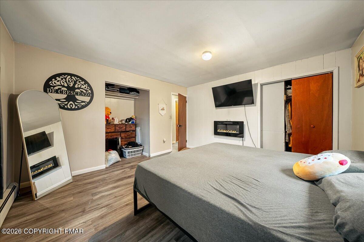 159 Summit Avenue Pocono Summit, PA 18346 - Photo 15 of 21 a bedroom with a bed and a television