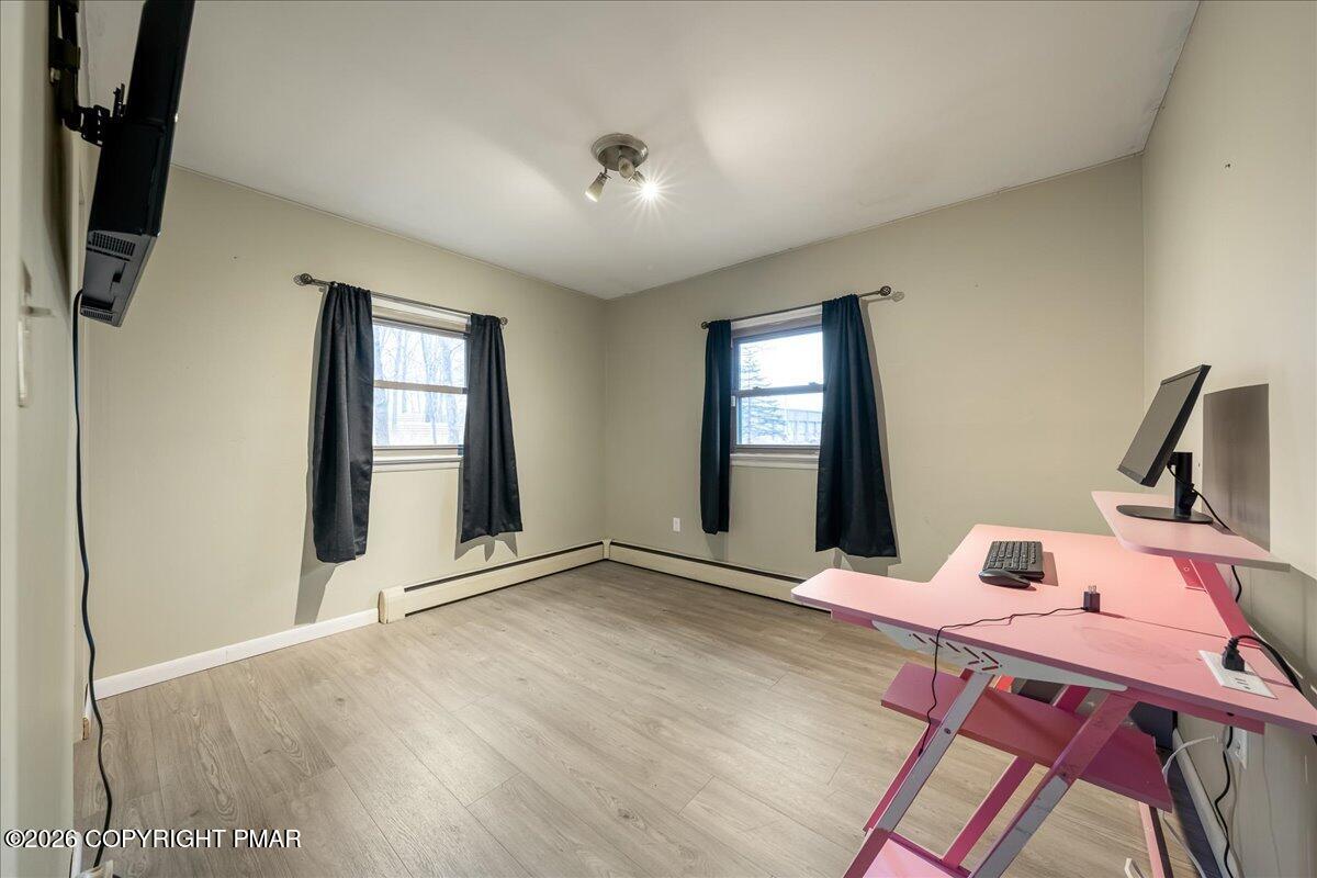 159 Summit Avenue Pocono Summit, PA 18346 - Photo 16 of 21 a view of a workspace with furniture and a window
