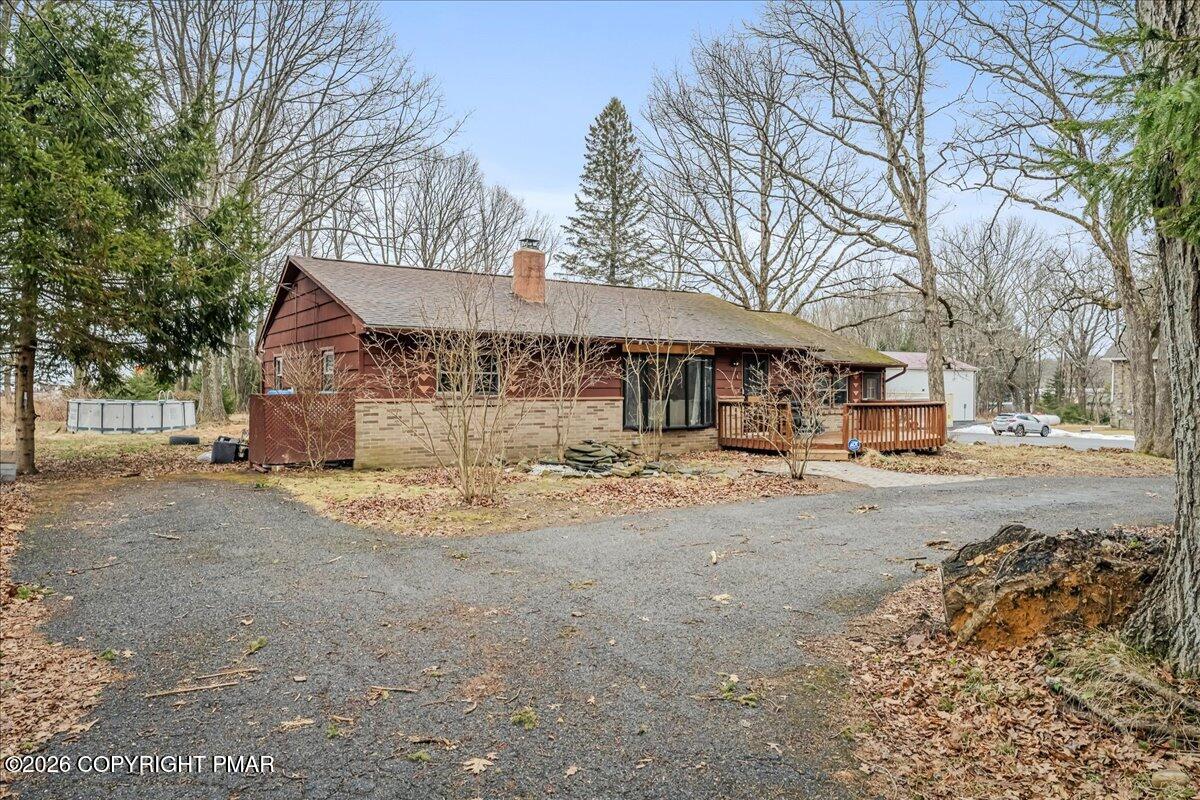 159 Summit Avenue Pocono Summit, PA 18346 - Photo 17 of 21 a view of a house with snow on the road
