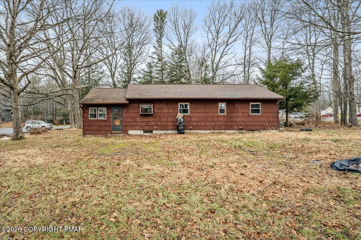 159 Summit Avenue Pocono Summit, PA 18346 - Photo 18 of 21 a front view of a house with a yard