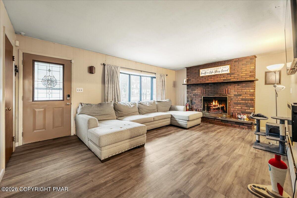 159 Summit Avenue Pocono Summit, PA 18346 - Photo 4 of 21 a living room with furniture and a fireplace