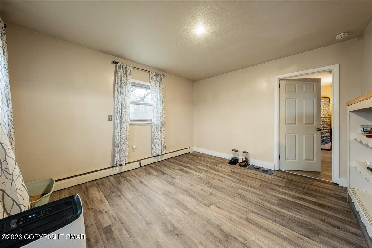 159 Summit Avenue Pocono Summit, PA 18346 - Photo 8 of 21 a view of empty room with wooden floor and fan