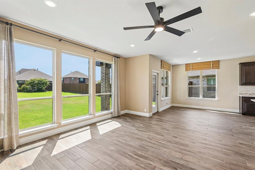 1228 Abbeygreen Road Forney, TX 75126 - Photo 13 of 31 Open concept kitchen and living room