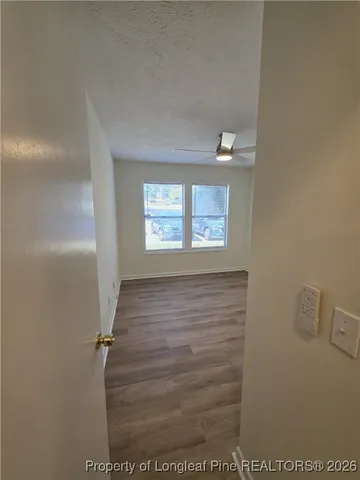 a view of an empty room with a window