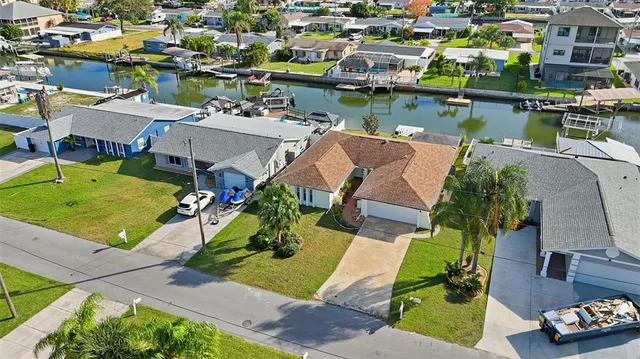 an aerial view of a house with a lake view