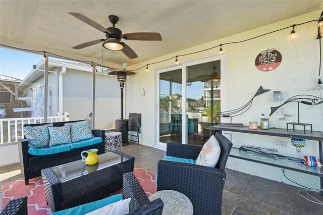a living room with furniture a rug and white walls