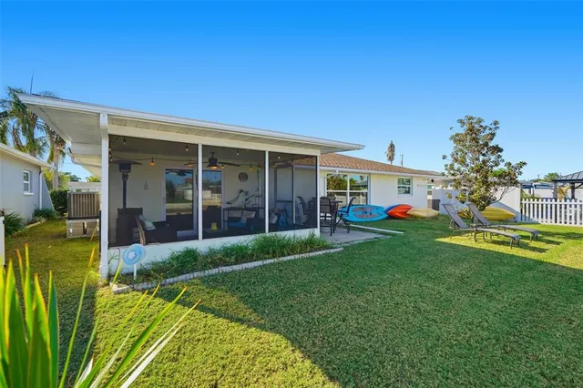 a view of an house with backyard space and garden