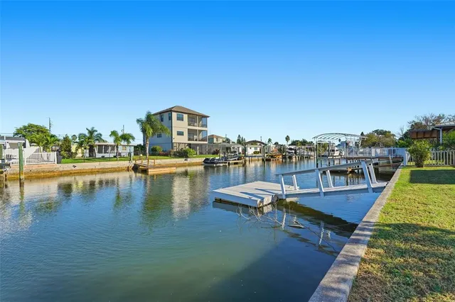 a view of a lake with outdoor seating