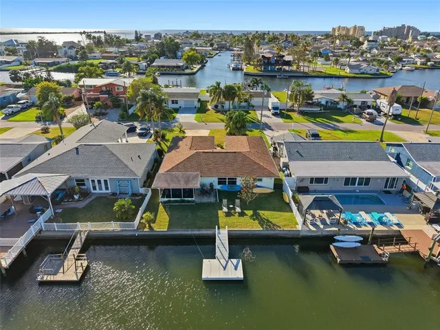 a view of a swimming pool with a table and chairs