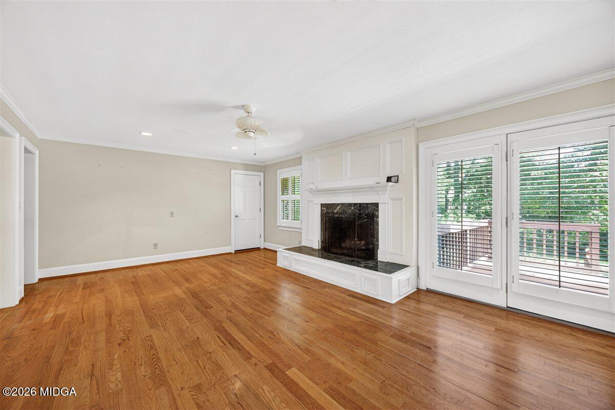 335 Hamrick Road Macon, GA 31220 - Photo 13 of 41 a view of empty room with wooden floor and fireplace