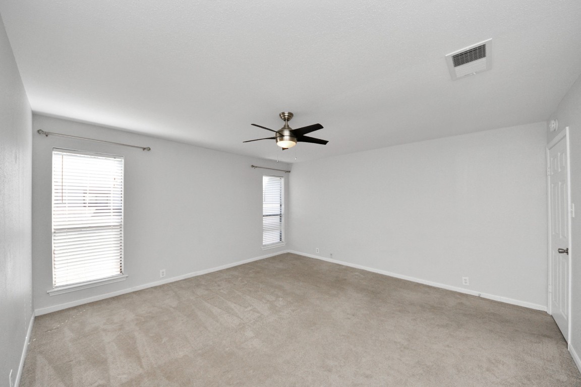 2468 Bering Drive Houston, TX 77057 - Photo 20 of 30 Spacious primary suite offering comfort and relaxation at the end of the day. Large windows provide natural light and a bright, inviting atmosphere.
