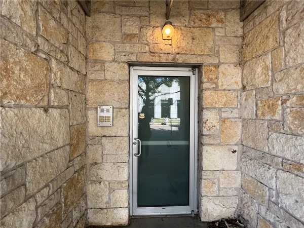 a view of entryway with a front door
