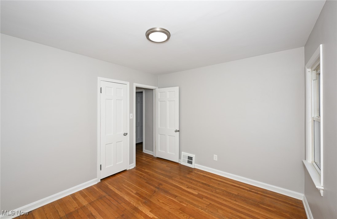 1571 Lander Road Cleveland, OH 44124 - Photo 11 of 39 Unfurnished bedroom with hardwood / wood-style flooring and baseboards