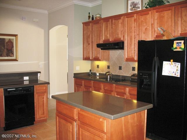 376 North Lombardy Loop Jacksonville, FL 32259 - Photo 12 of 24 a kitchen with stainless steel appliances granite countertop a refrigerator a stove and a sink