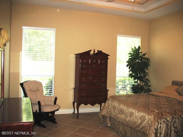 376 North Lombardy Loop Jacksonville, FL 32259 - Photo 14 of 24 a bedroom with a bed and a chair