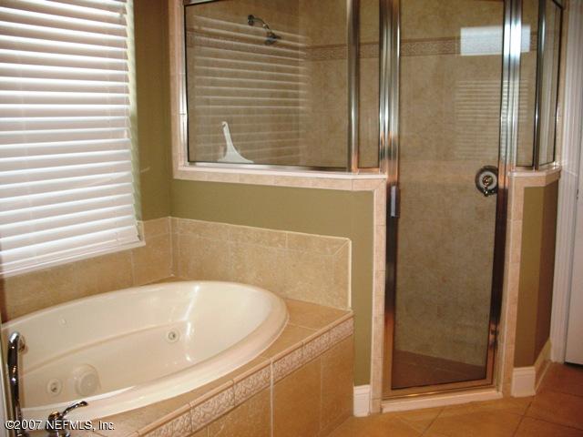 376 North Lombardy Loop Jacksonville, FL 32259 - Photo 16 of 24 a bathroom with a bathtub and a shower