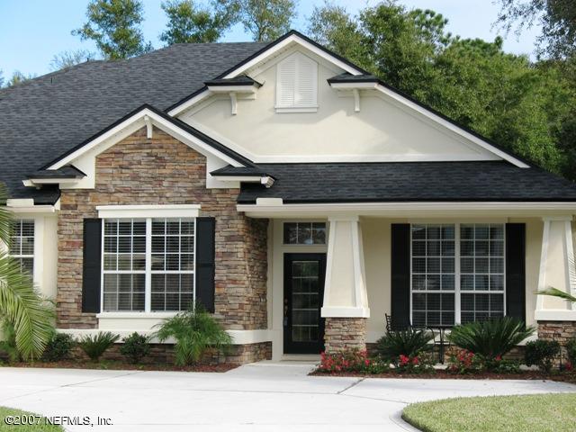 376 North Lombardy Loop Jacksonville, FL 32259 - Photo 2 of 24 a front view of a house with a yard and garage