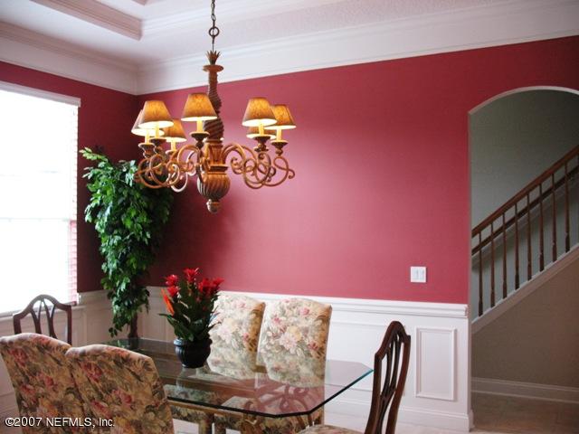 376 North Lombardy Loop Jacksonville, FL 32259 - Photo 3 of 24 a view of a dining room with furniture and chandelier