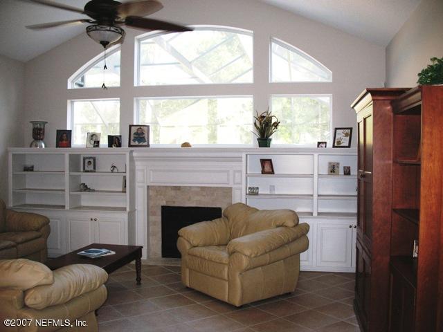 376 North Lombardy Loop Jacksonville, FL 32259 - Photo 6 of 24 a living room with furniture and a fireplace