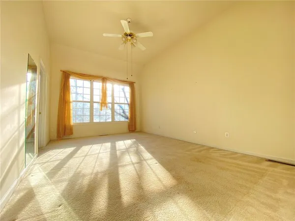 a view of an empty room and window