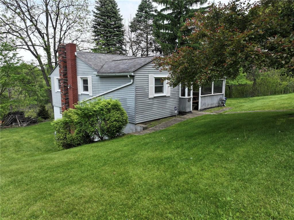531 Laughlin Avenue Pittsburgh, PA 15210 - Photo 3 of 35 a front view of a house with a yard and trees