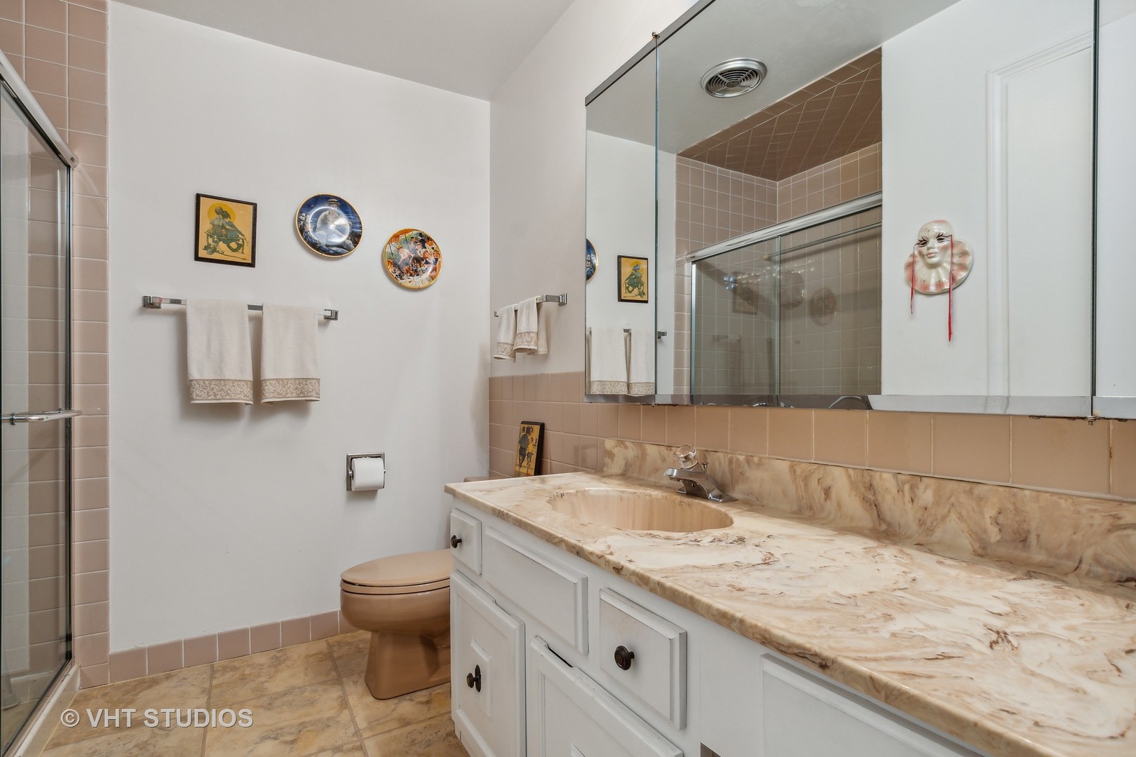 9801 Gross Point Road, Unit 308 Skokie, IL 60076 - Photo 11 of 16 a bathroom with a granite countertop sink and a mirror