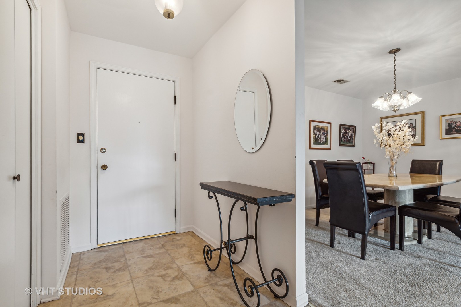 9801 Gross Point Road, Unit 308 Skokie, IL 60076 - Photo 3 of 16 a view of a dining room with furniture window and wooden floor
