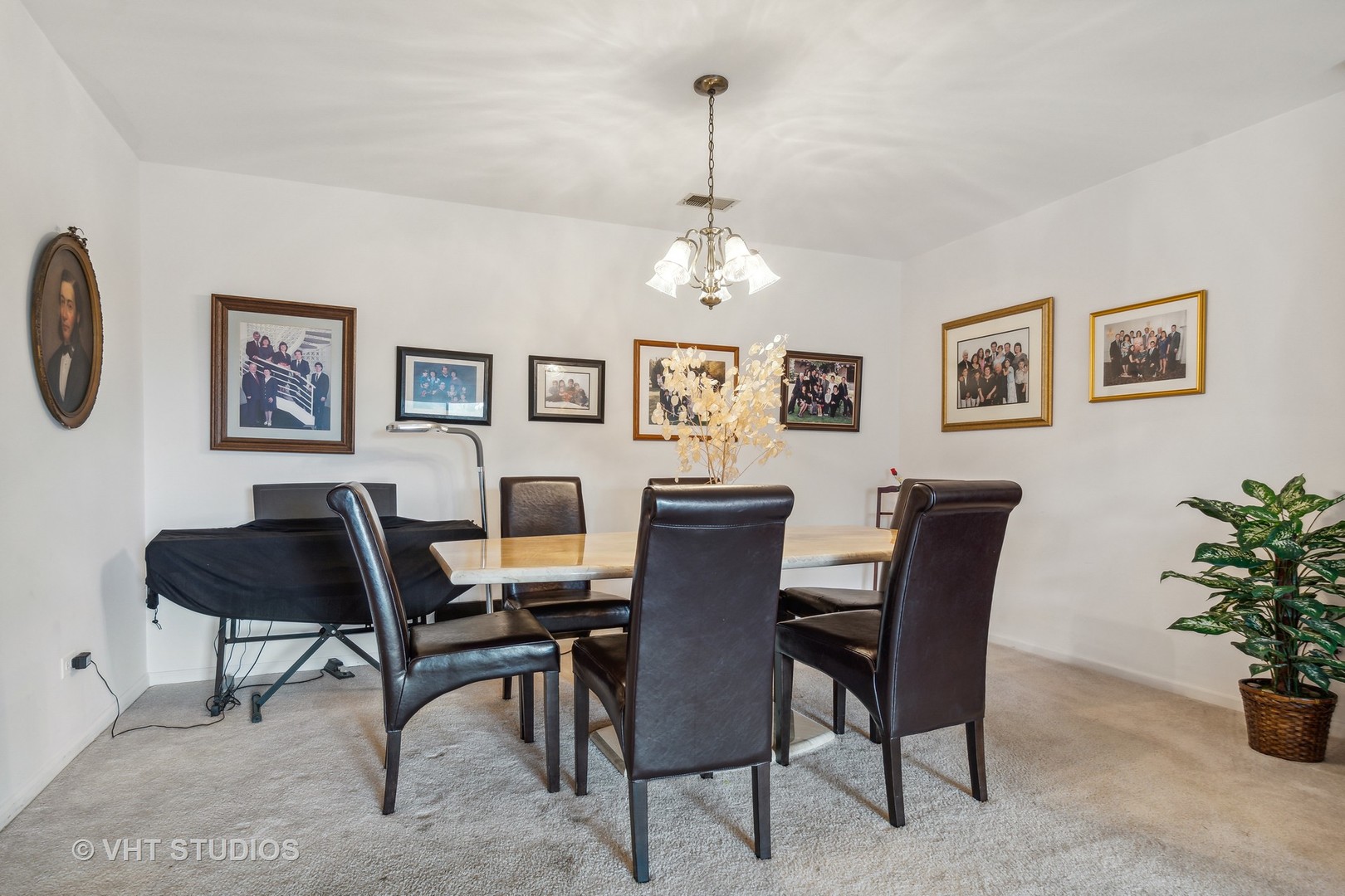 9801 Gross Point Road, Unit 308 Skokie, IL 60076 - Photo 5 of 16 a view of a dining room with furniture and chandelier