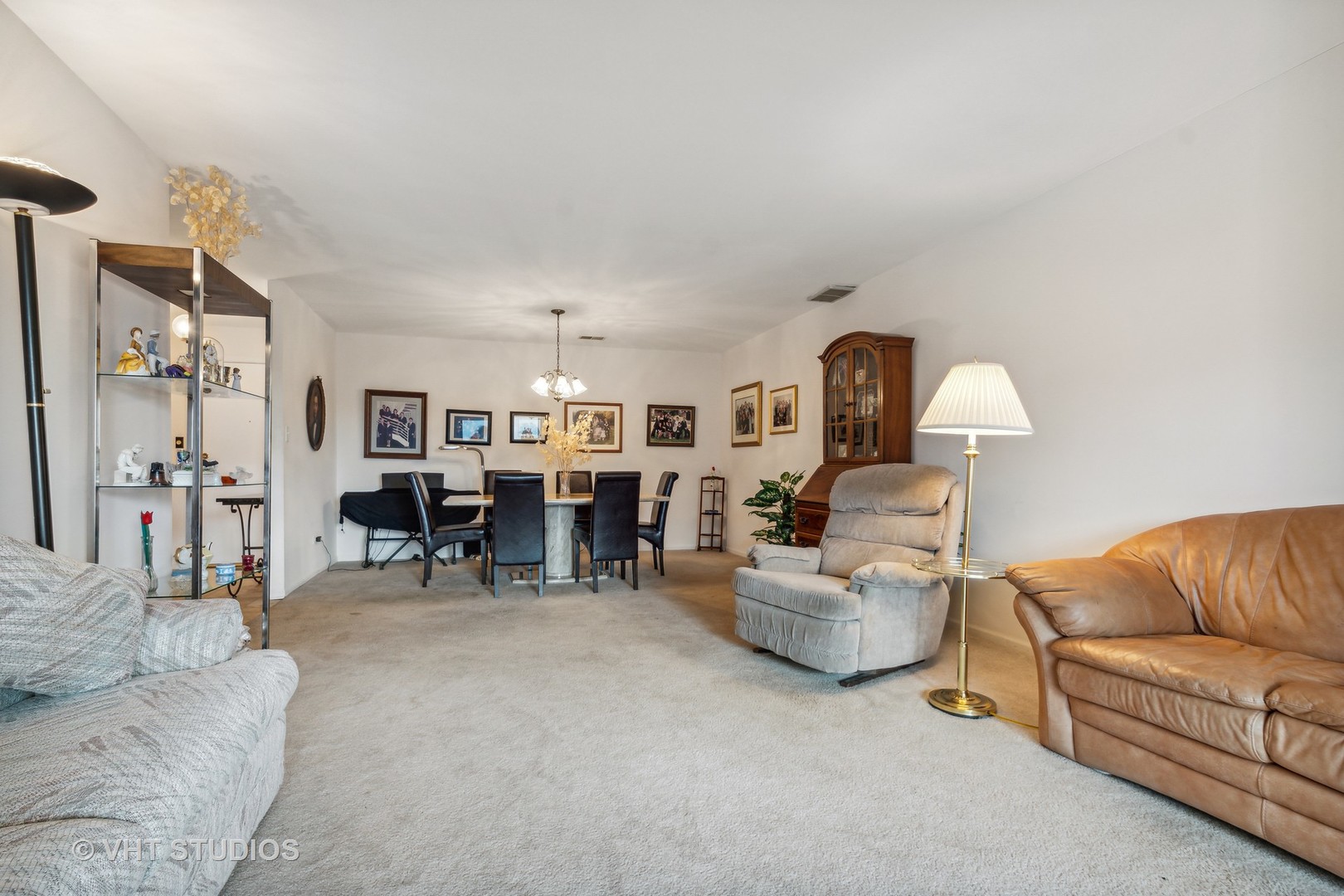 9801 Gross Point Road, Unit 308 Skokie, IL 60076 - Photo 6 of 16 a living room with furniture and a couch