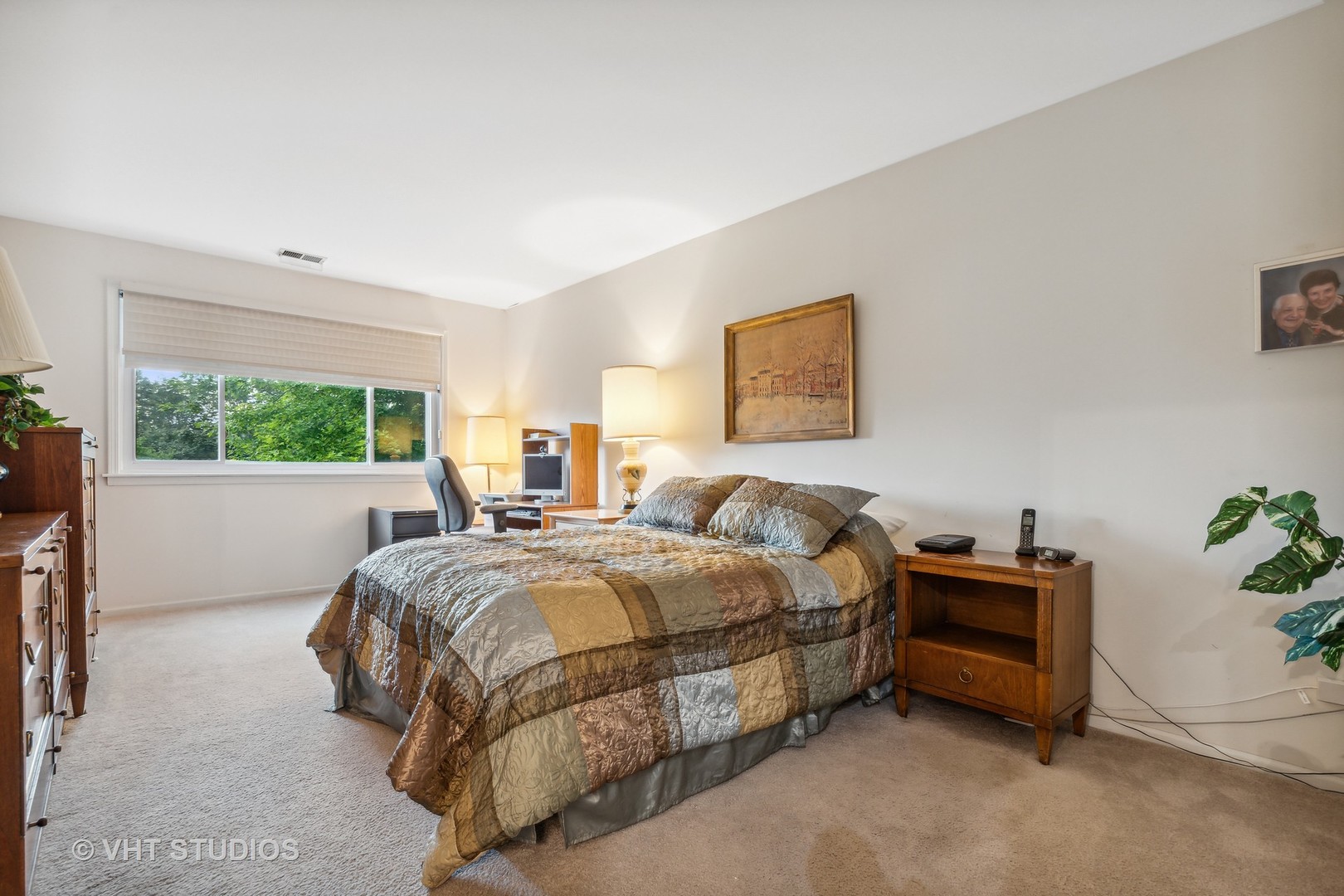 9801 Gross Point Road, Unit 308 Skokie, IL 60076 - Photo 10 of 16 a bed room with a bed and a window
