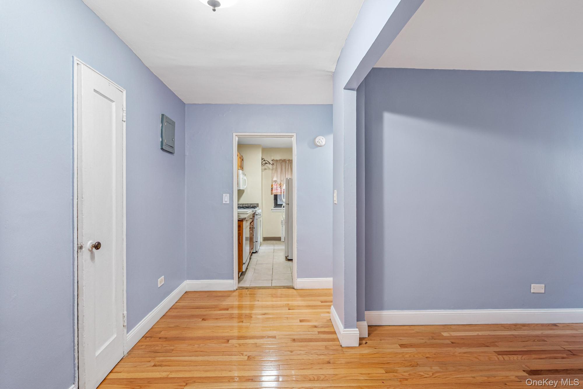 102-55 67th Road, Unit 2V Queens, NY 11375 - Photo 3 of 14 a view of a livingroom with wooden floor and closet