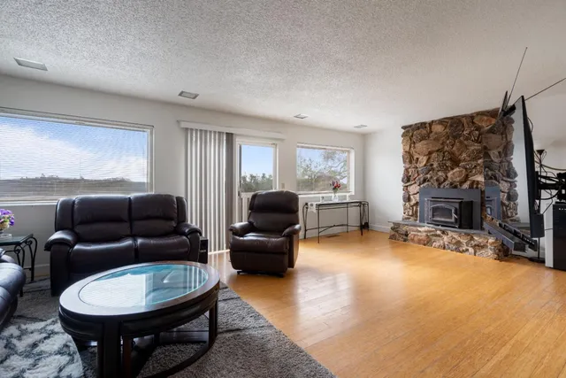 a kitchen with stainless steel appliances granite countertop wooden cabinets a sink and dishwasher