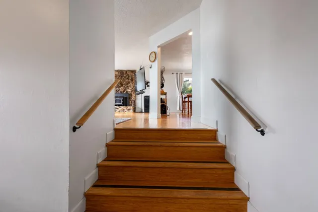 a dining room with furniture window entryway and wooden floor