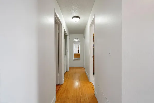 a bedroom with a bed and a mirror