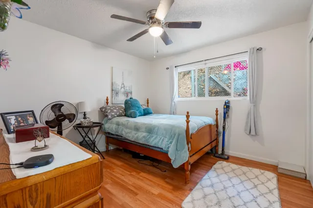 a bedroom with a bed and a desk