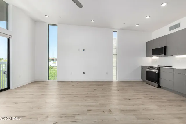 a view of a kitchen with a sink and a window