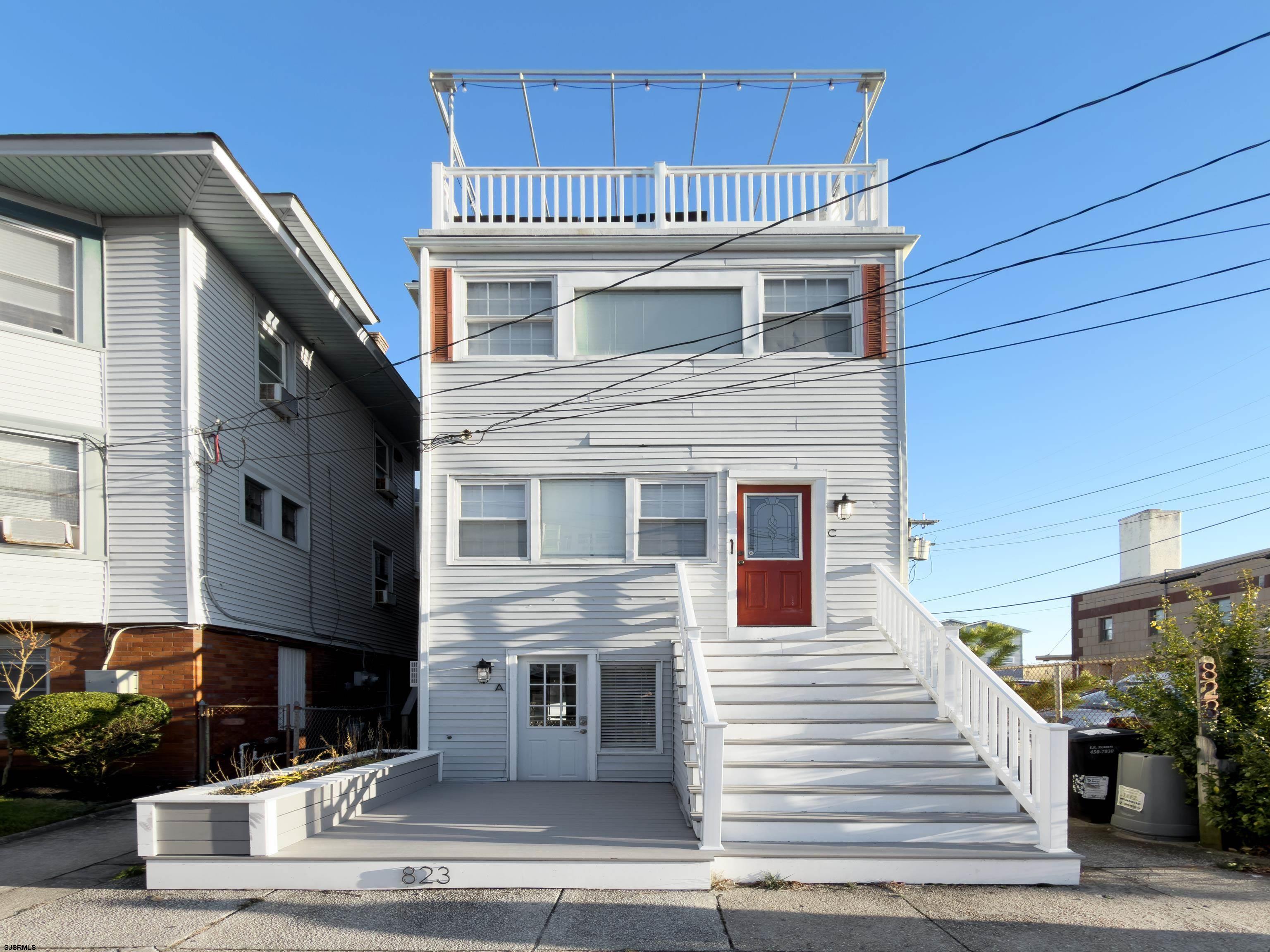 a view of a house with a roof deck