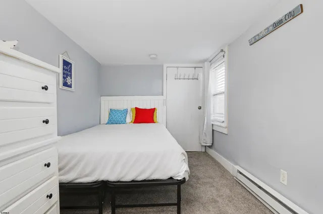 a bedroom with a bed and a closet